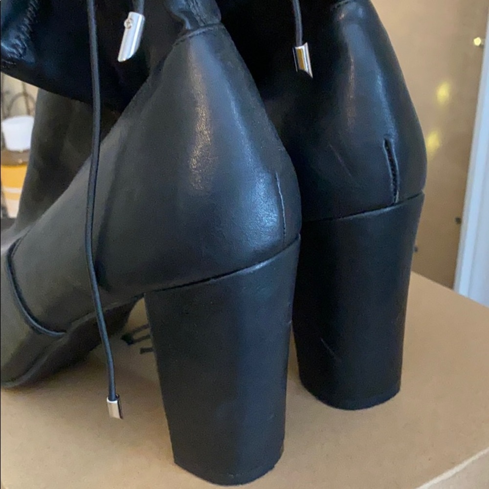 Size 11 leather heeled bootie. Never worn.